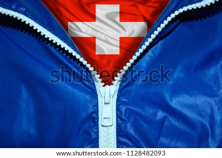 Flag of Switzerland under a blue unpacked zipper