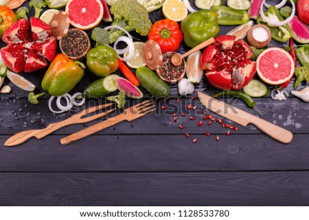 Fresh vegetables and fruits with cutlery