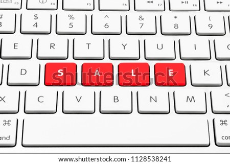 White wireless style keyboard with red keys spelling "SALE"