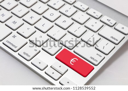 White wireless style keyboard with red € "EURO" key.