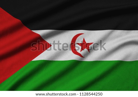 Western Sahara flag  is depicted on a sports cloth fabric with many folds. Sport team banner