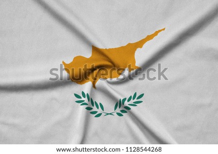 Cyprus flag  is depicted on a sports cloth fabric with many folds. Sport team banner