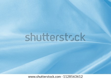 Blue fabric texture for background and design, beautiful pattern of silk or linen.