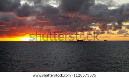 Sunset in the offshore area, drilling ship in an offshore day 