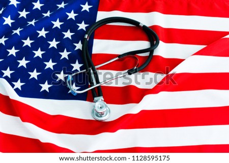Closeup of stethoscope on american national flag.