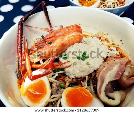 Tom yum kung (Thai cuisine),Tom Yum Kung seafood soup with noodles. Tom yam is a spicy clear soup typical in Thailand
