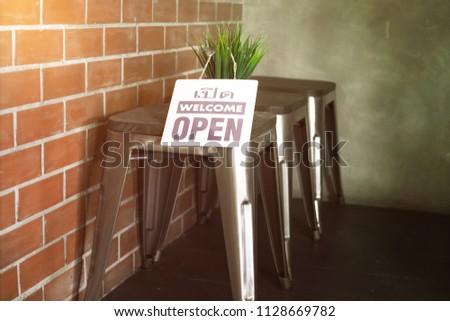 Open sign board at coffee shop.