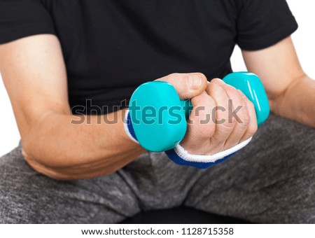 Close up picture of senior man holding blue dumbbells - working out on isolated
