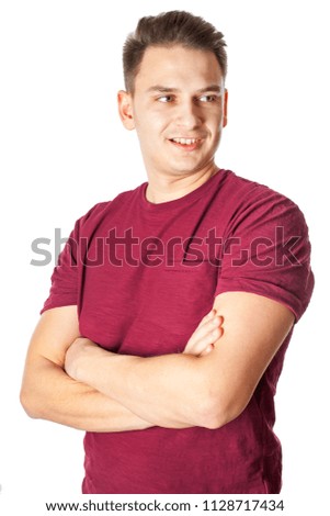 Young handsome man with arms crossed smiling at the camera H