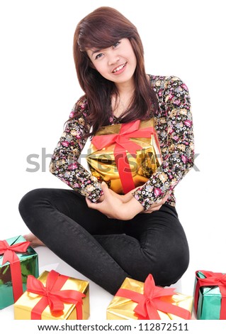 cheerful young woman embracing many gifts,, isolated on white background