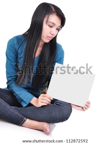 look sad - portrait of a woman holding a blank sheet of paper, isolated on white background