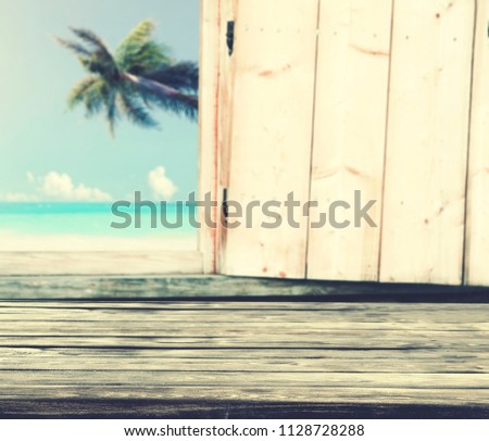 Table of wood with free space and window background.  