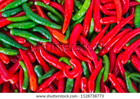 Cooked chili peppers are prepared to cook with red and ripe chili peppers and green peppers, which are used to make spicy curry and are popular for Thai people.
Background in top view