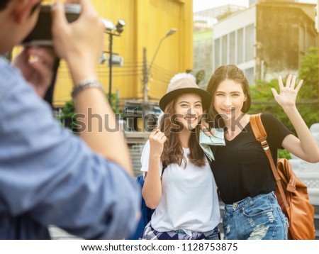 travel concept.group of happy friends are traveling.traveler talk photo smiling face girls