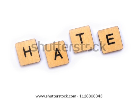 The word HATE, spelt with wooden letter tiles.