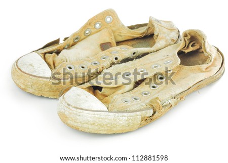 old sneakers on white background.