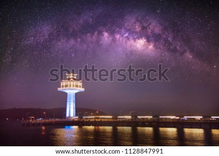 Milky Way galaxy, on lighthouse on the island of Sichang,Chonburi province, Thailand,Long exposure photograph, with grain.Image contain certain grain or noise and soft focus.