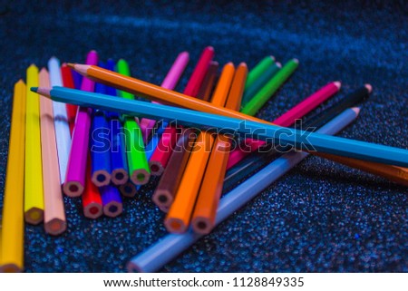 Colorful lapis on bright black background