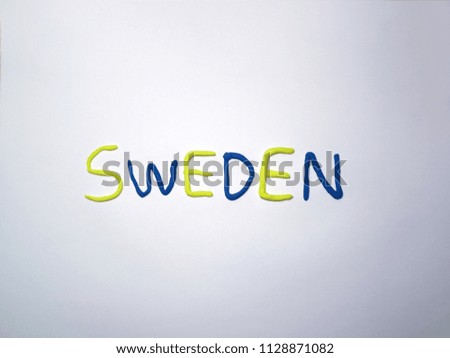 alphabet sweden made with yellow and blue color clay on the white background
