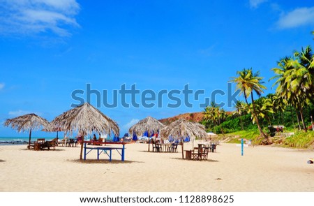 Beautiful beach with palm trees, Praia do Amor, near Pipa, Rio Grande do Norte, Brazil Royalty-Free Stock Photo #1128898625
