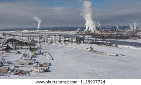 Aerial view of the Sault Sainte Marie, Michigan locks in winter, with boad traffic halted by ice
