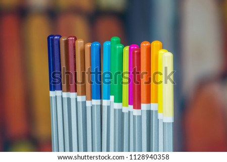 Set of color drawing pencils with colorful background