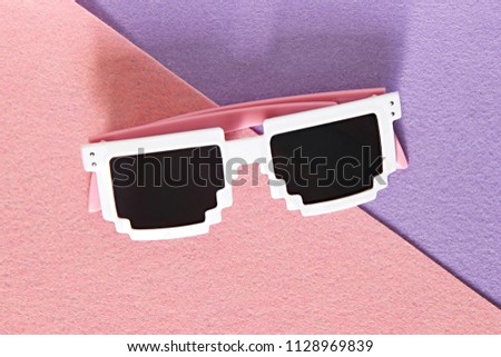 White Pixel glasses on a pink and purple background.