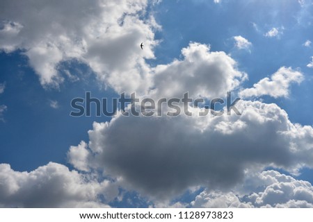 Full frame background of the blue sky is covered with clouds