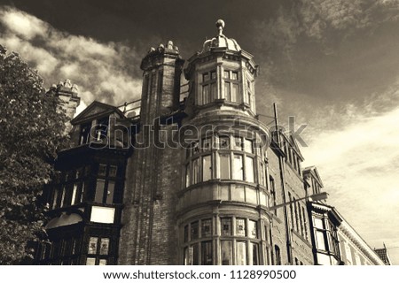 Beautiful facades of Salisbury (England, UK). Sepia photo.