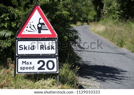 Skid risk road sign gravel max speed 20 mph twenty safety for drivers