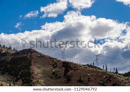 high-voltage substation on blue sky background