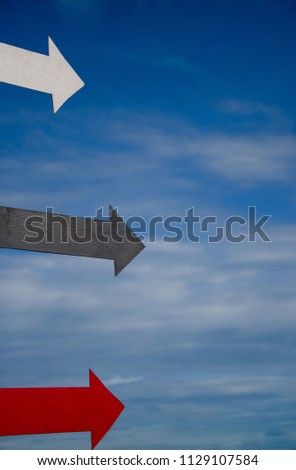 Navigation arrows for guide or point to the direction symbol with blue sky background.