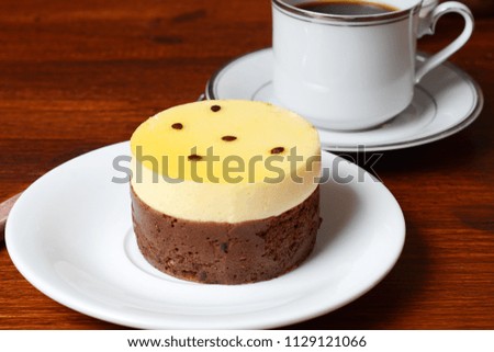 Close up of passion fruits cake and coffee. Breakfast concept