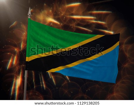 Flag of Tanzania with fireworks display in the background