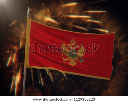 Flag of Montenegro with fireworks display in the background