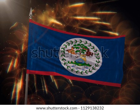 Flag of Belize with fireworks display in the background