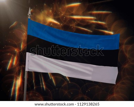 Flag of Estonia with fireworks display in the background