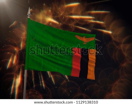 Flag of Zambia with fireworks display in the background