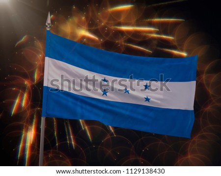 Flag of Honduras with fireworks display in the background