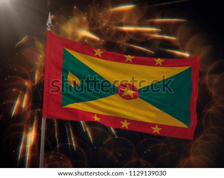 Flag of Grenada with fireworks display in the background