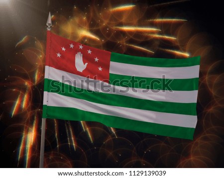 Flag of the Republic of Abkhazia with fireworks display in the background