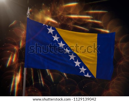 Flag of Bosnia and Herzegovina with fireworks display in the background
