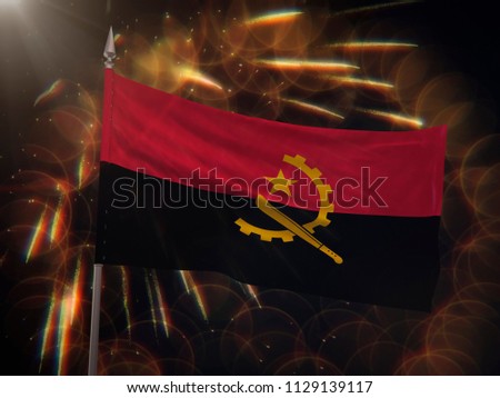 Flag of Angola with fireworks display in the background