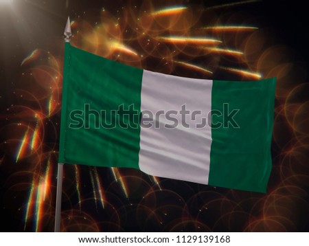 Flag of Nigeria with fireworks display in the background