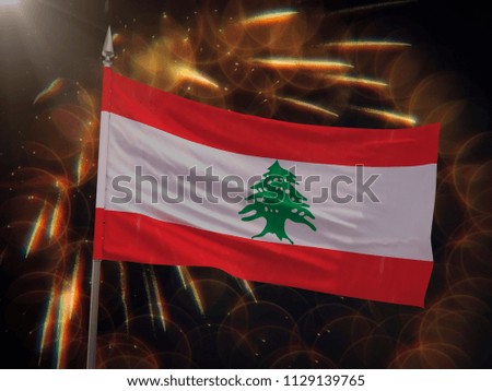 Flag of Lebanon with fireworks display in the background