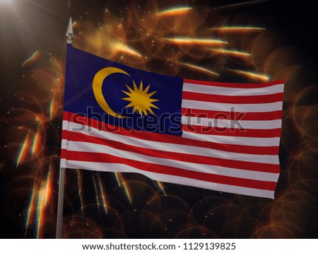 Flag of Malaysia with fireworks display in the background