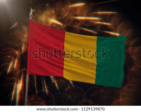 Flag of Guinea with fireworks display in the background