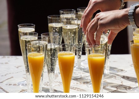 Welcome Drink. Glasses of Champagne and Orange Juice. Royalty-Free Stock Photo #1129154246