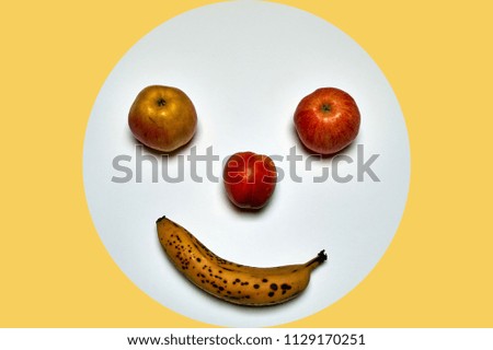 minimalist round fruit face made of apple, peach and banana