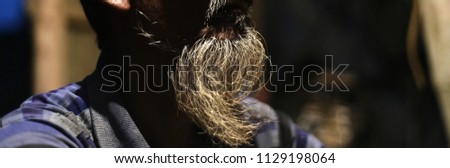 White beard of a sitting old man isolated unique photograph